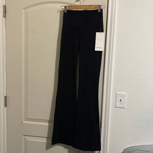 Lululemon new with tag, size 4, color black, Groove Pant SHR Flare Nulu